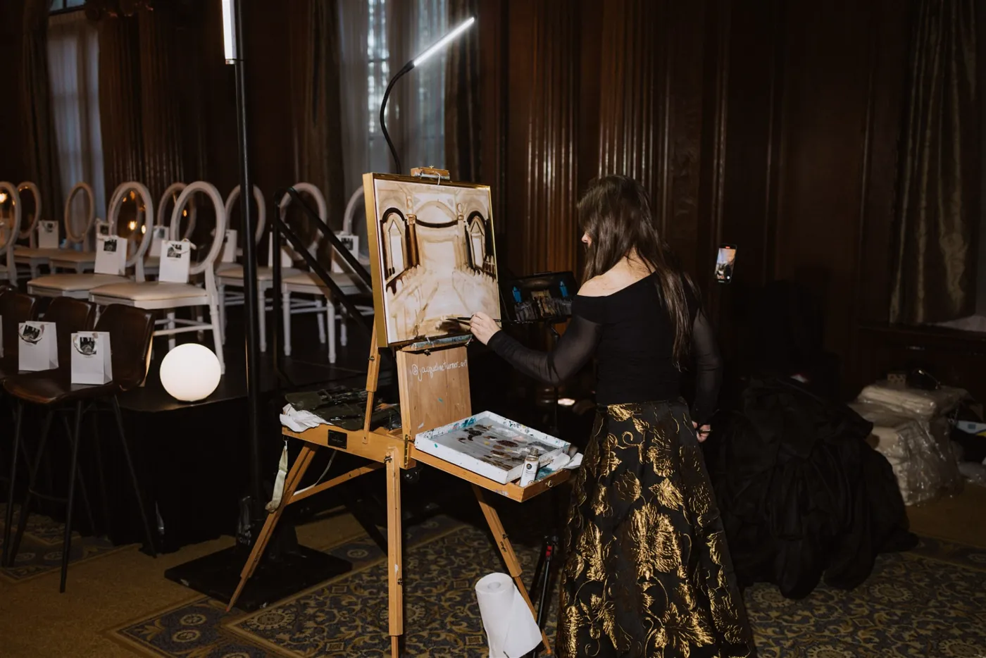Jacqueline Turner's easel set up beside the runway at the La Marie bridal show