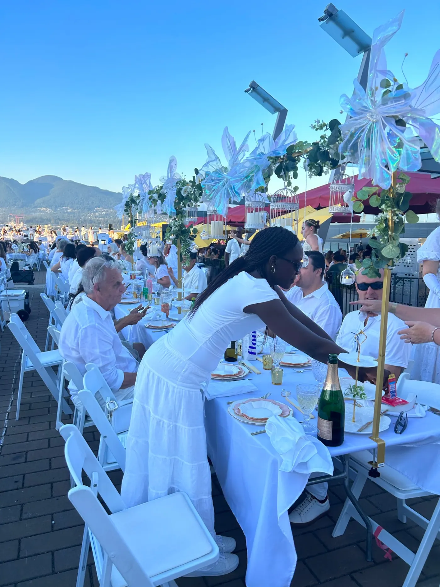 Decorated tables at Dinner en Blanc on the Vancouver waterfront